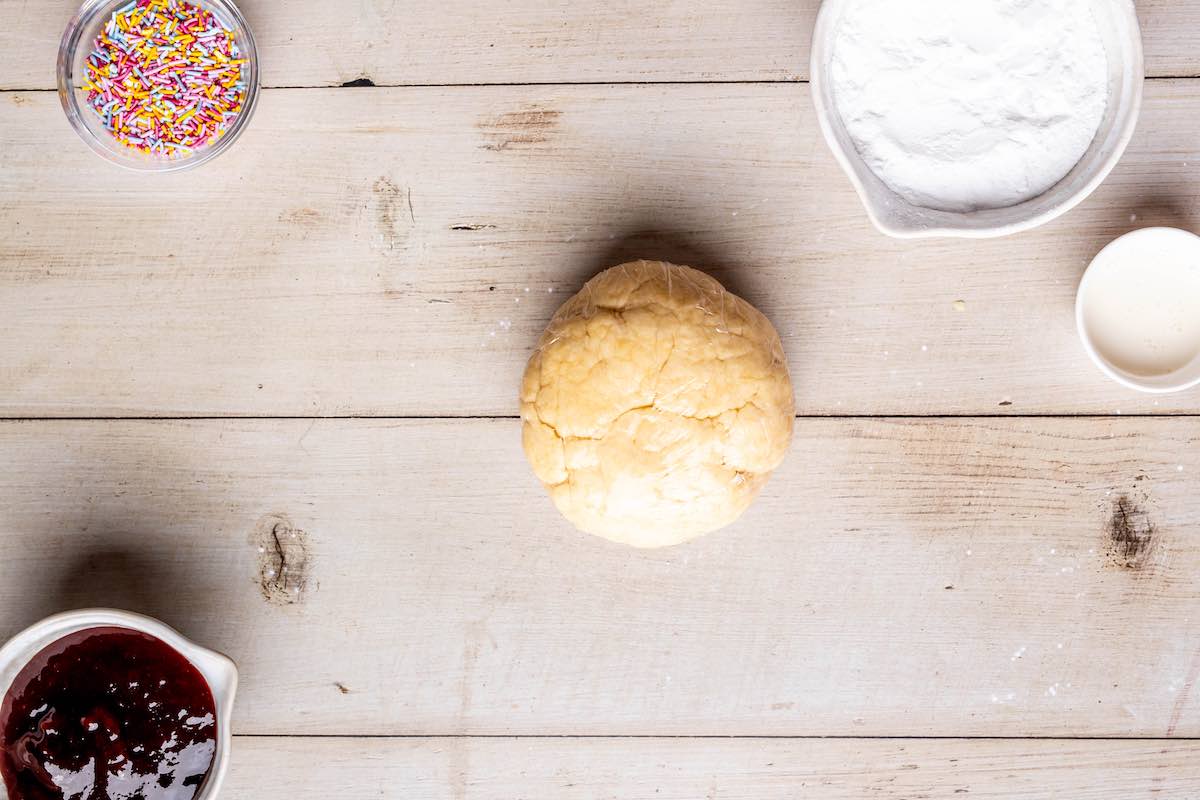 dough ball wrapped in plastic.