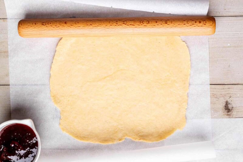 rolled out dough on a baking sheet.