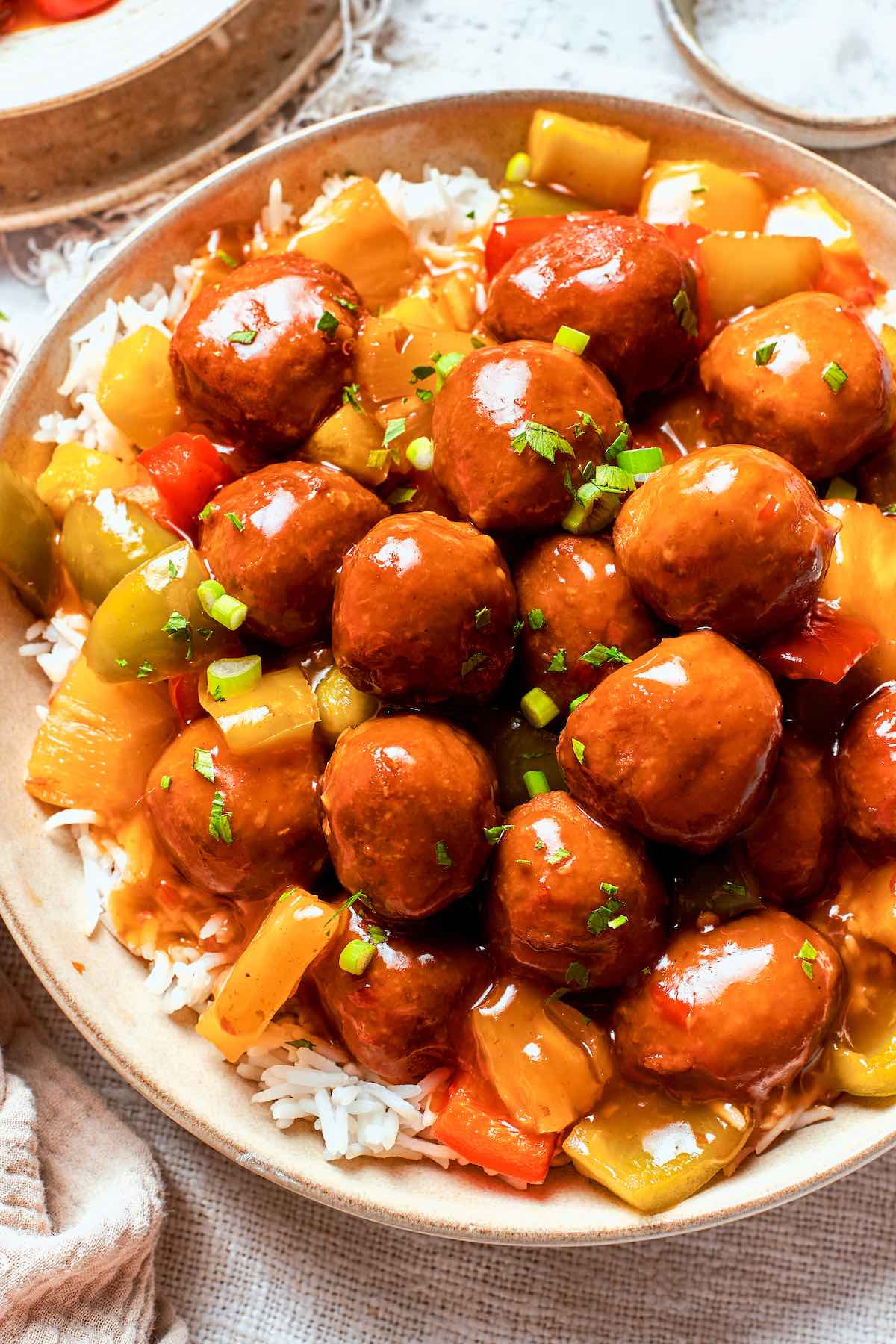 homemade sweet and sour meatballs over rice.