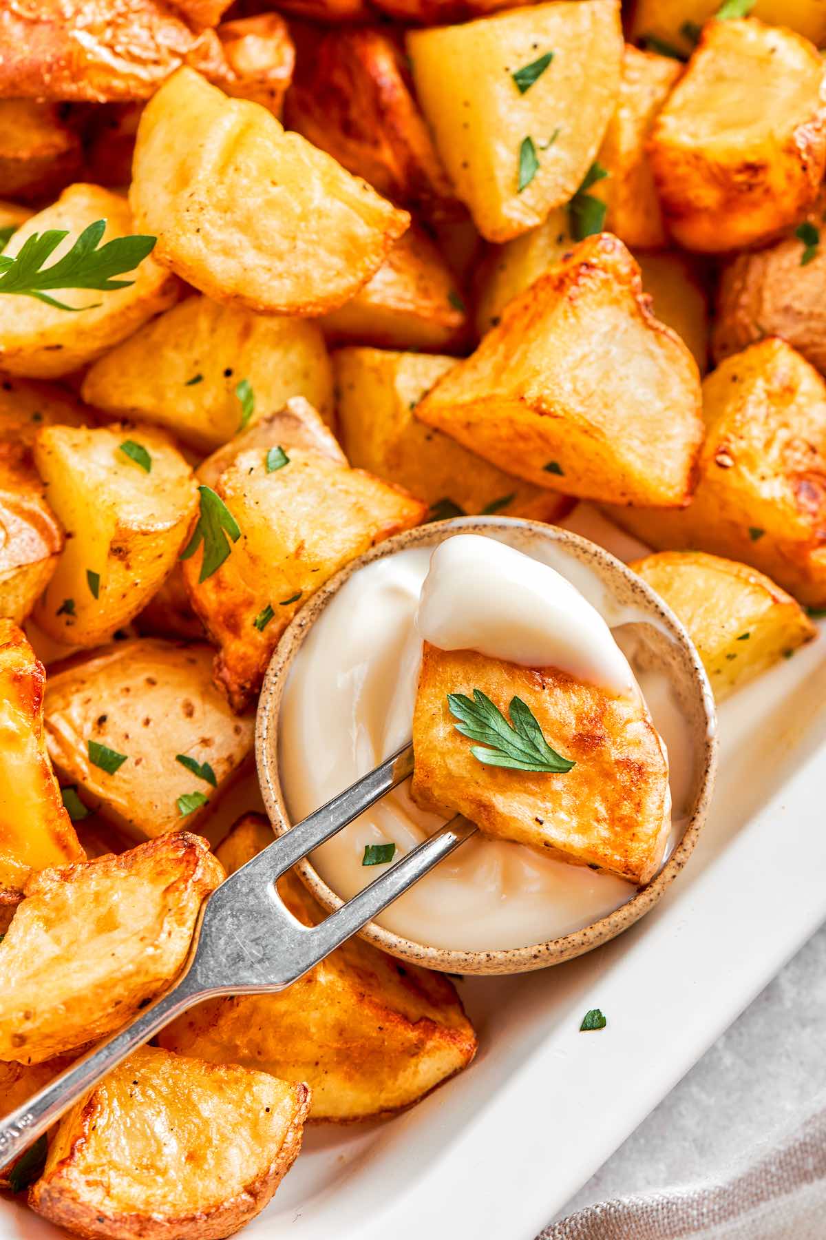 platter of air fried breakfast potatoes with dipping sauces.