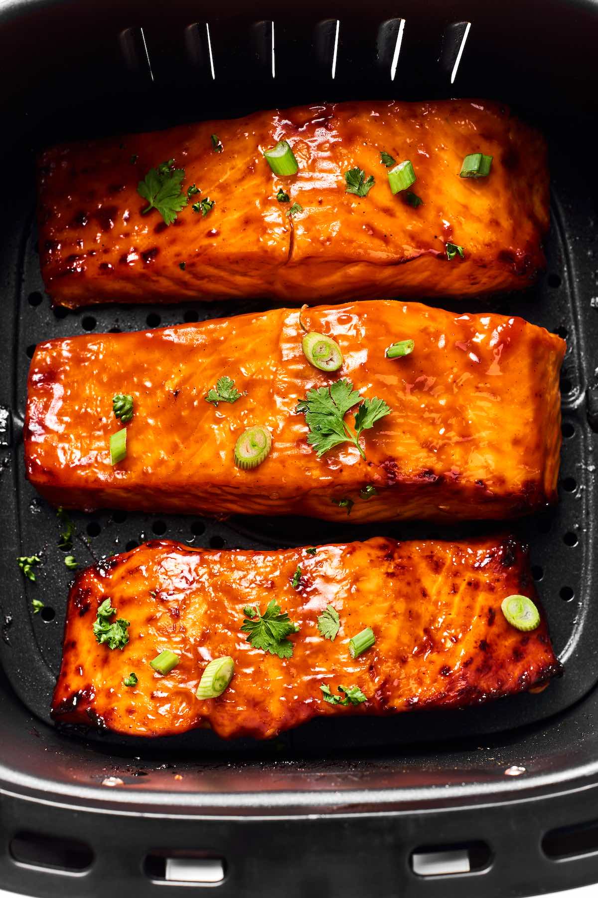 air fryer salmon in the air fryer basket.