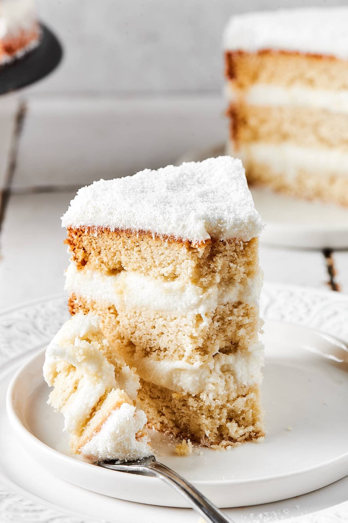 slice of coconut cake on a plate.