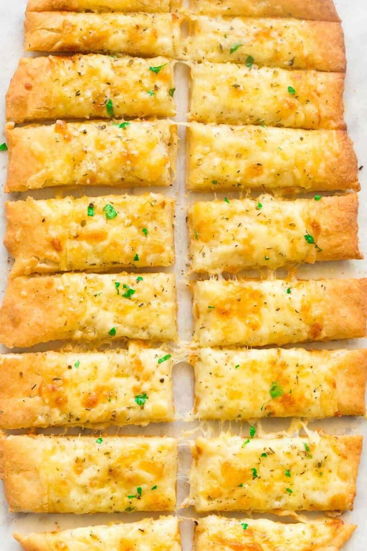 homemade garlic breadsticks with herbs.