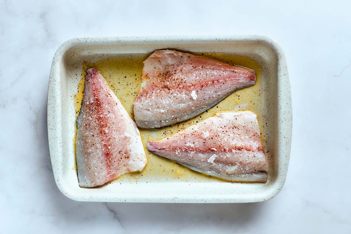 raw flounder fillets with salt and pepper on both sides.