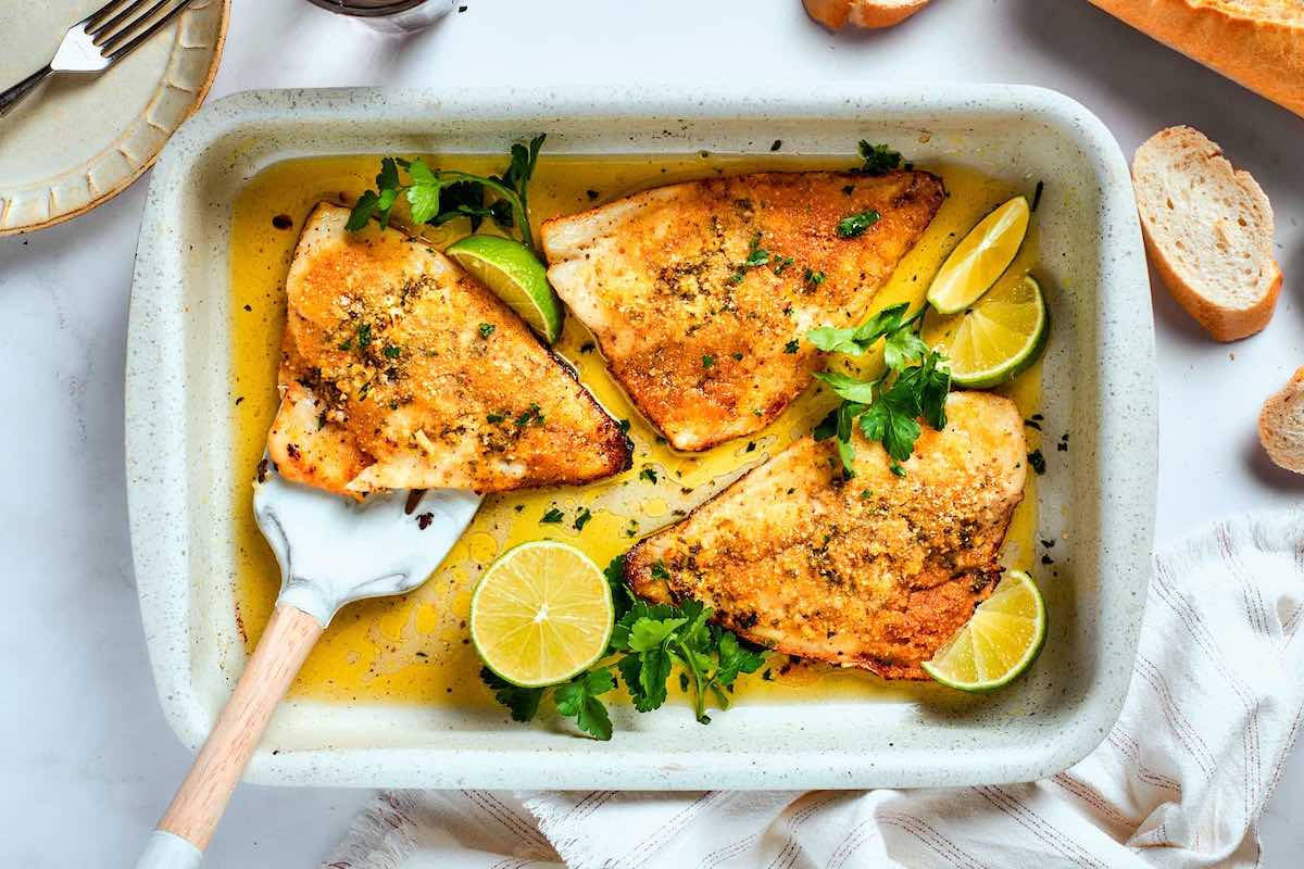 baked flounder in a baking dish.