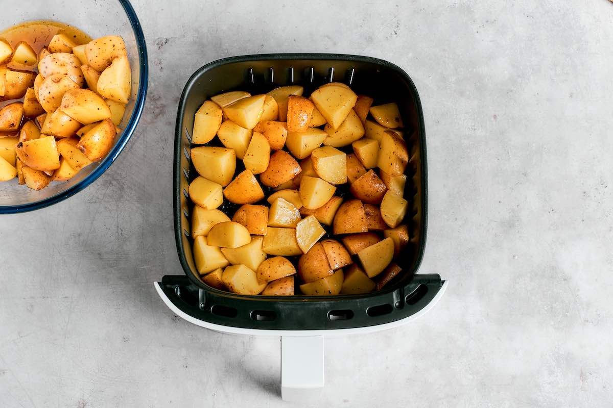 raw seasoned potatoes in the air fryer.