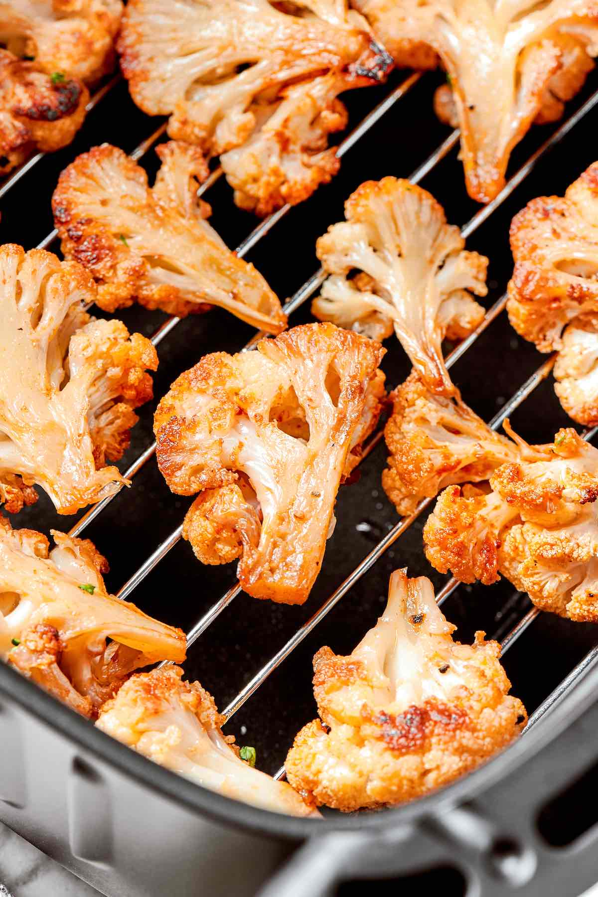 air fryer cauliflower in the air fryer basket.