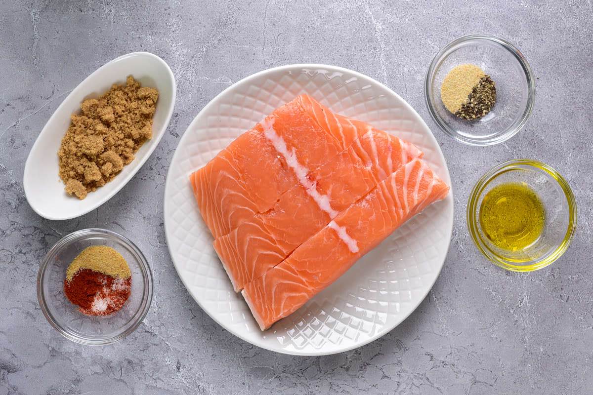 raw salmon fillets on a plate.