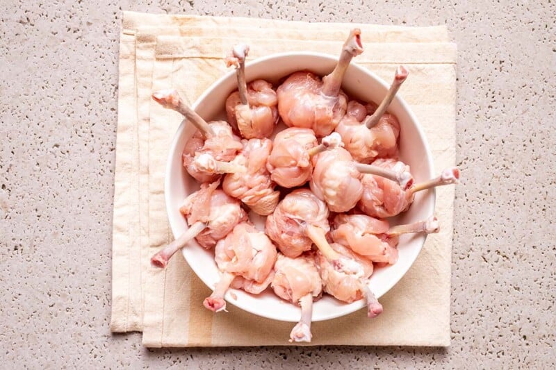 frenched chicken wings in a bowl.