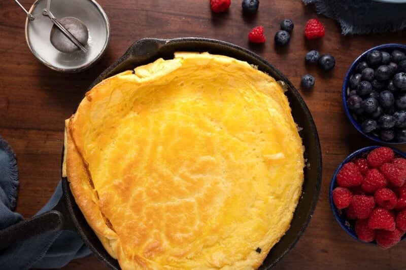 fluffy baked pancake in a skillet.