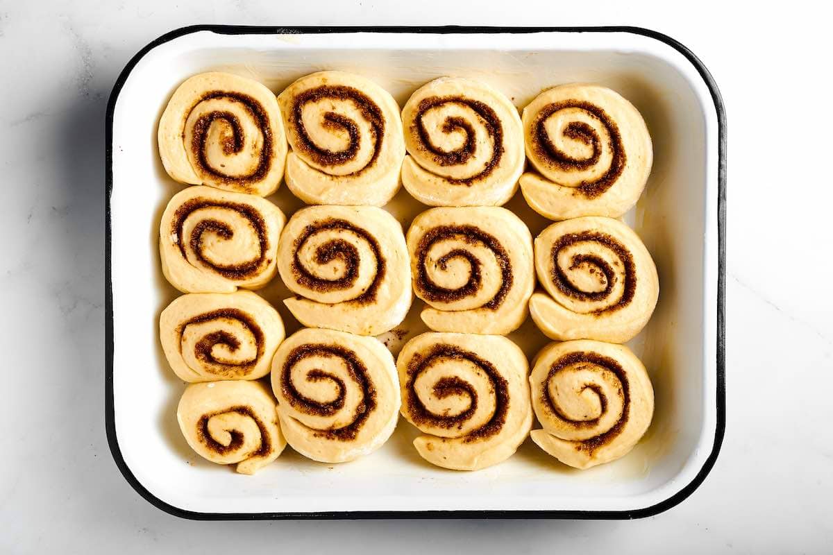 unbaked keto cinnamon rolls in a large baking dish.