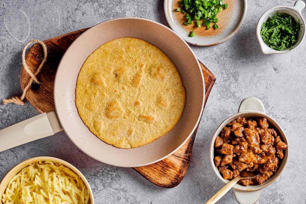 corn tortilla on a skillet.