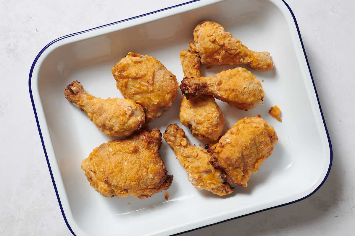 oven fried chicken in a baking dish.