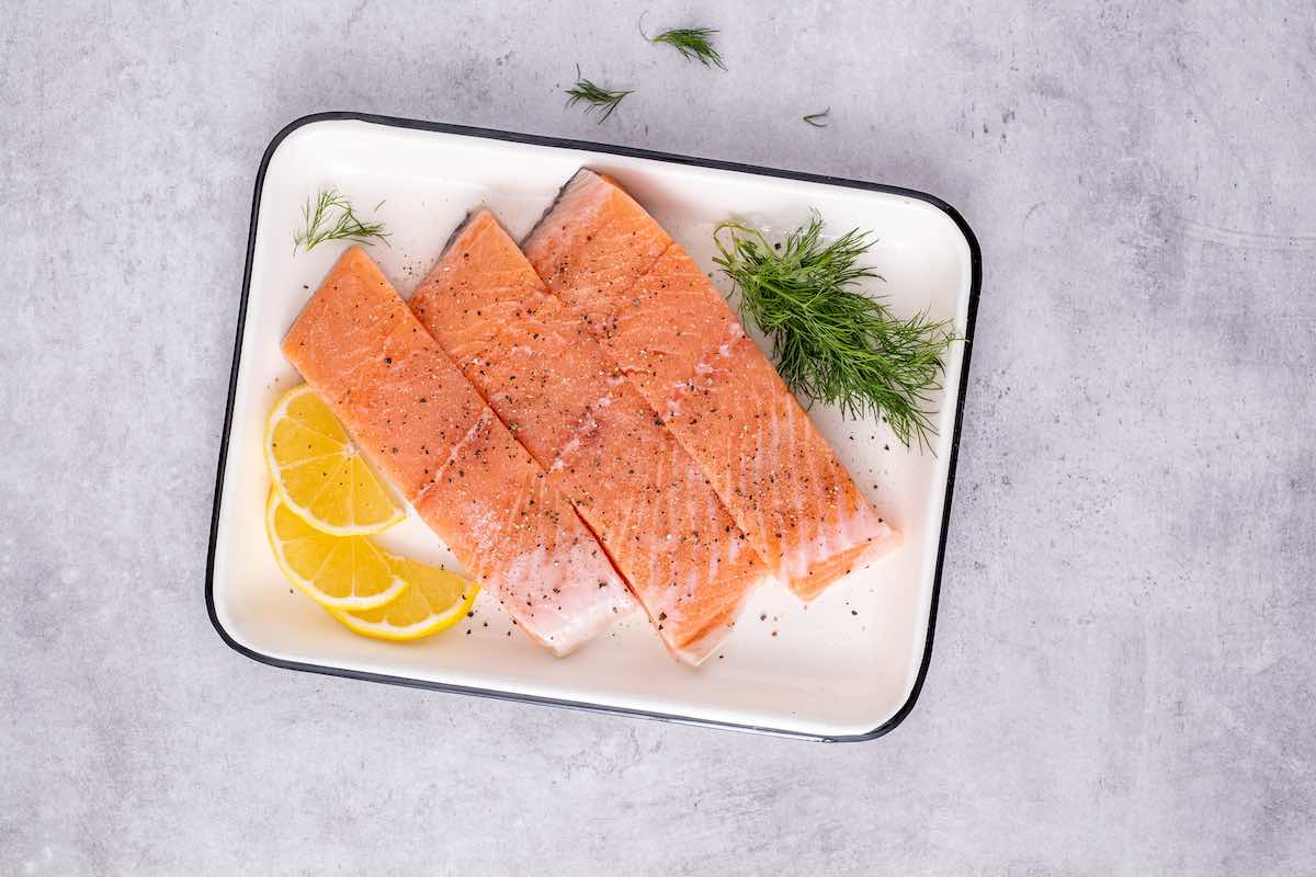 raw salmon fillets with salt and pepper.