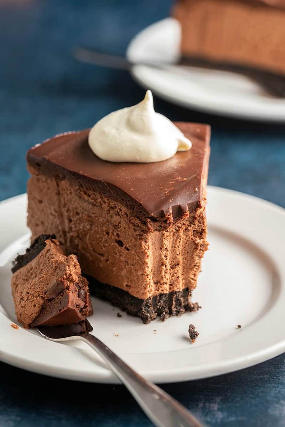 no bake chocolate cheesecake with whipped cream on top.