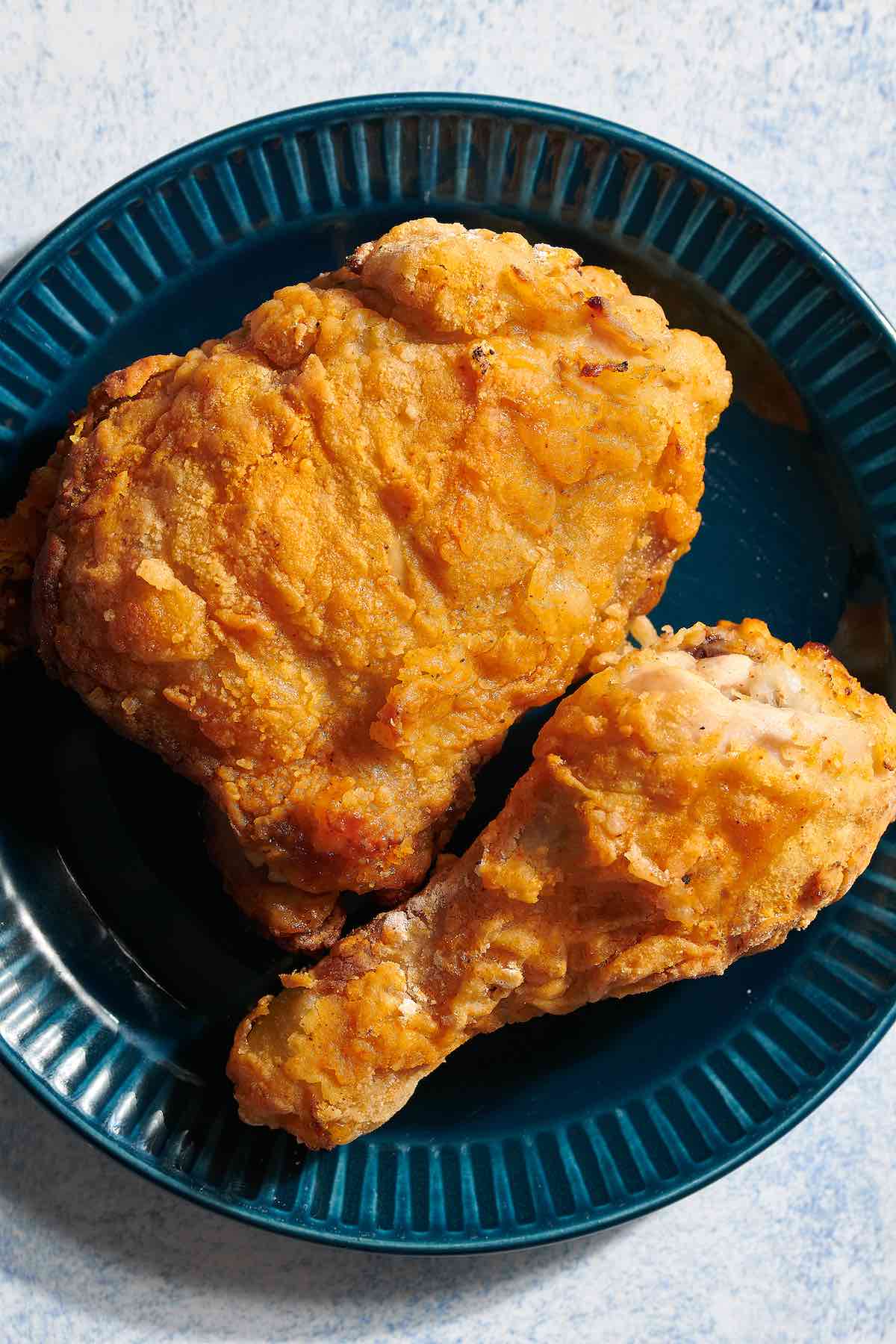 crispy oven baked fried chicken on a plate.