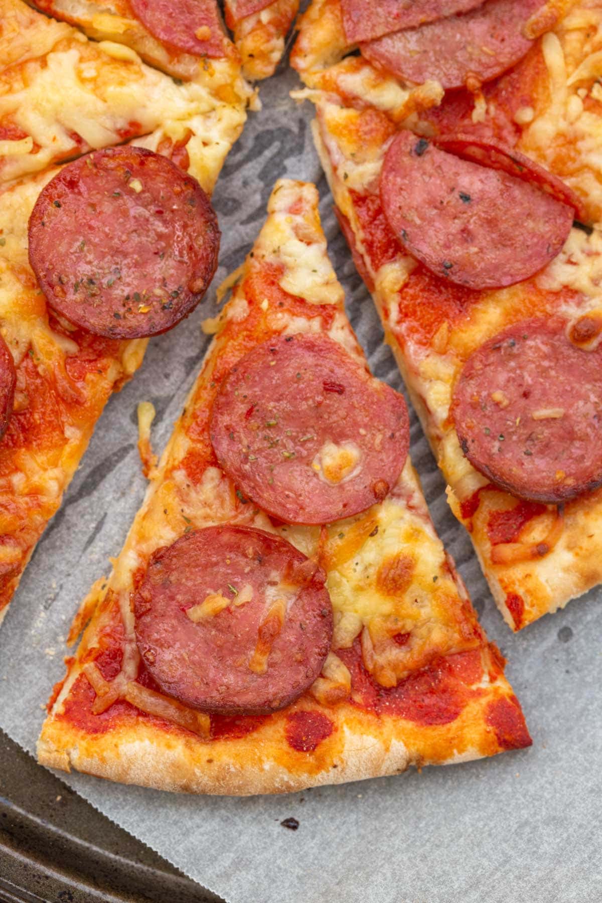 cottage cheese pizza with pepperoni and cheese.