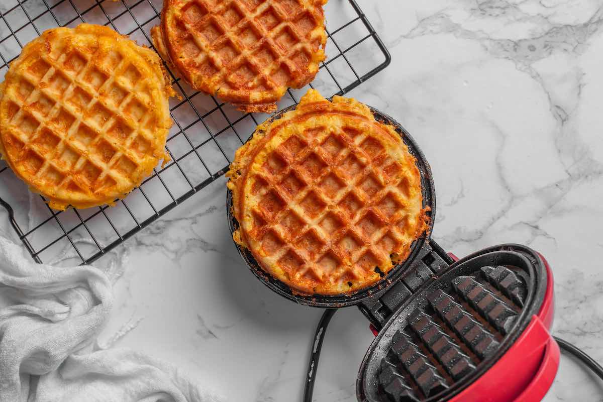 waffle maker with chaffle batter in it.