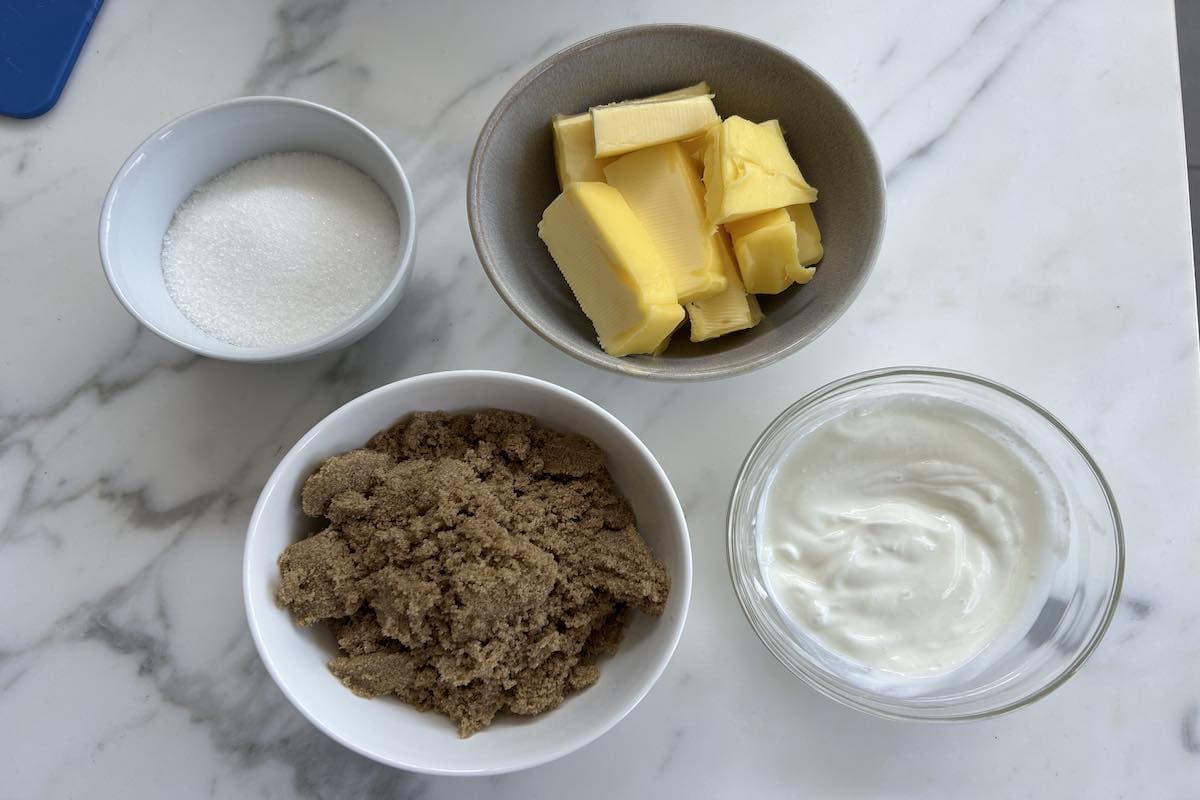 butter, sugar, and whipped cottage cheese in bowls.