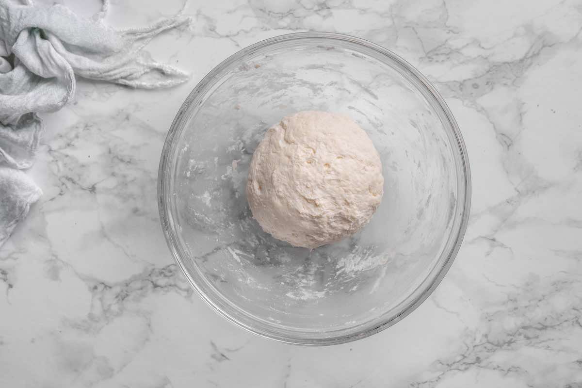 shaped ball of dough in a bowl.