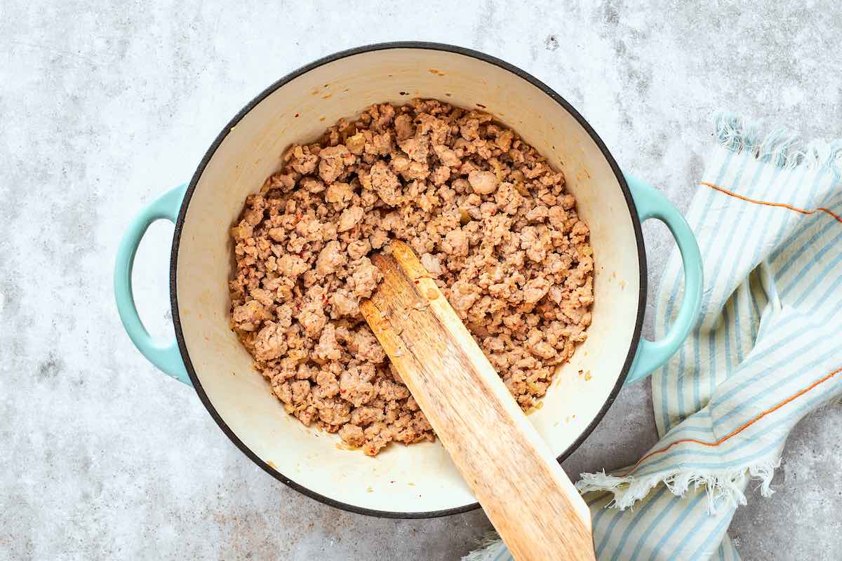 ground turkey cooking in a skillet.