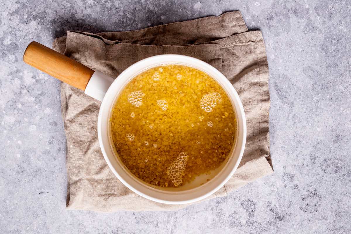 bulgar cooking in a saucepan with water.