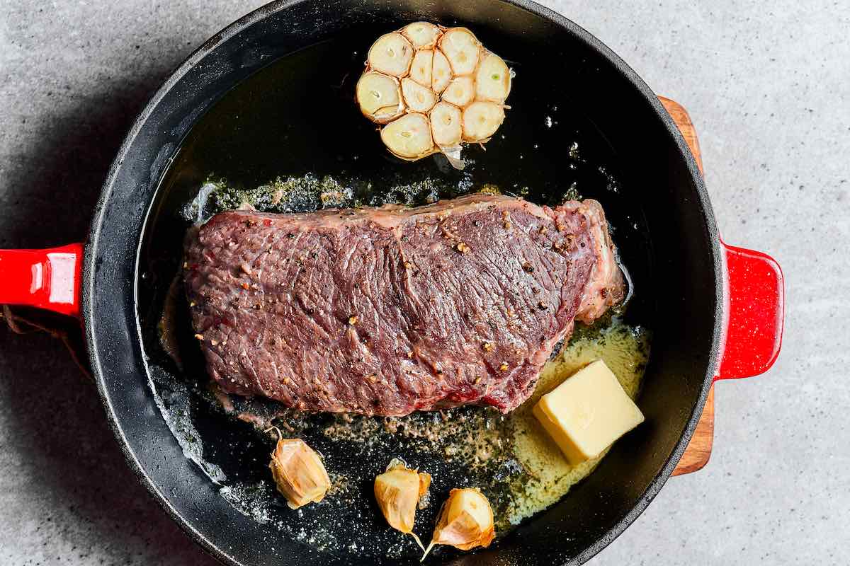 baked steak on a skillet.