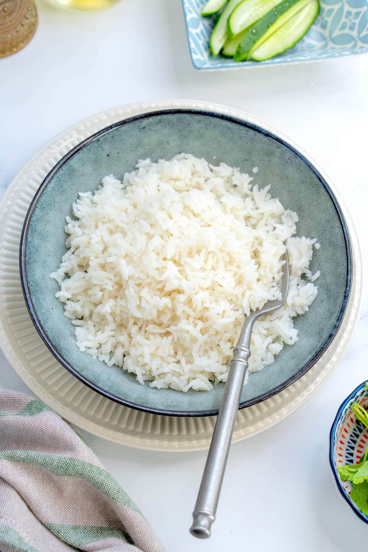 bowl of fluffy basmati rice with a fork.