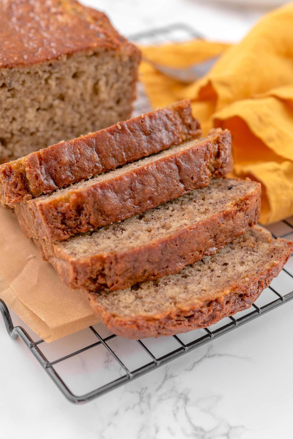 banana bread with cottage cheese on a wire rack.