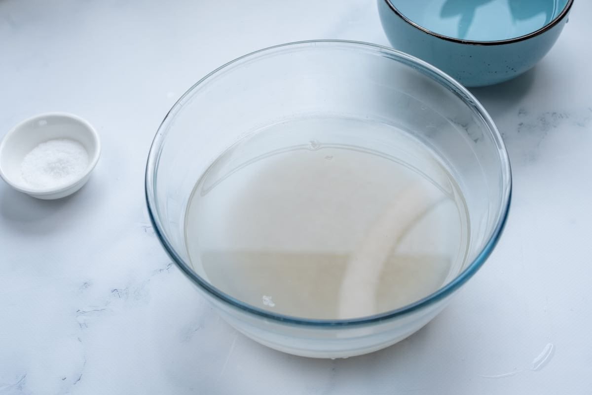 raw rice and water in the bowl.