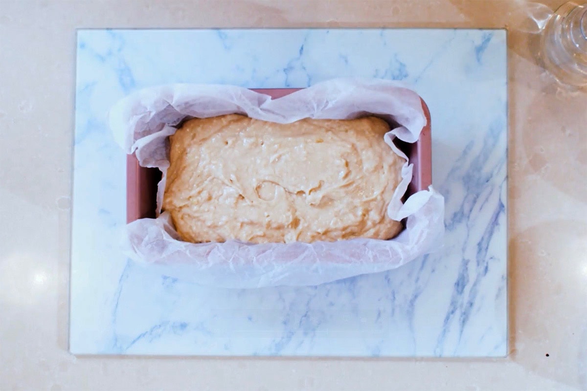 assembled banana bread batter in a loaf pan.