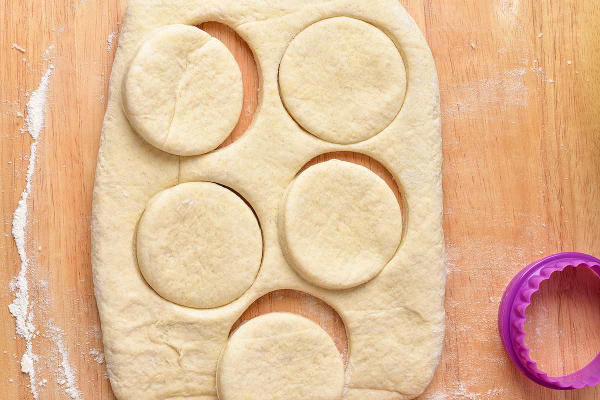 shaped biscuit dough on a chopping board.