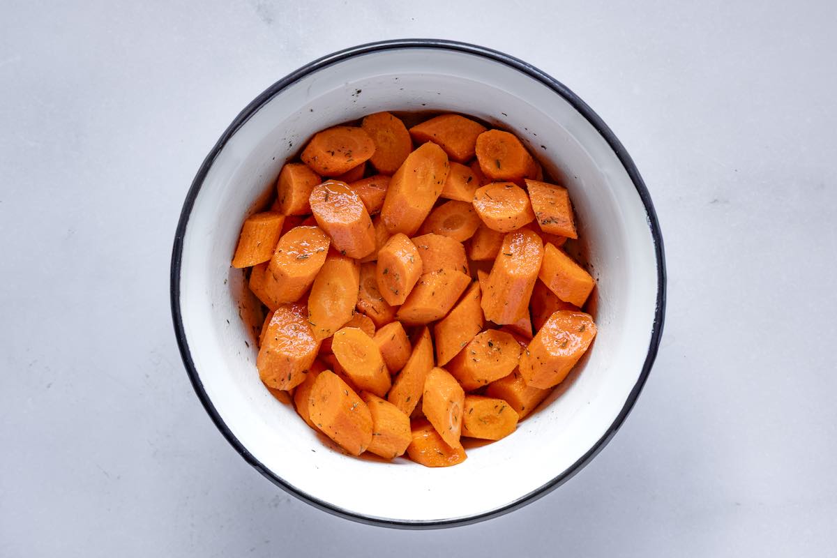seasoned raw carrots in a bowl.