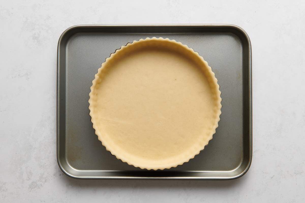 unbaked pie crust in a pie dish.