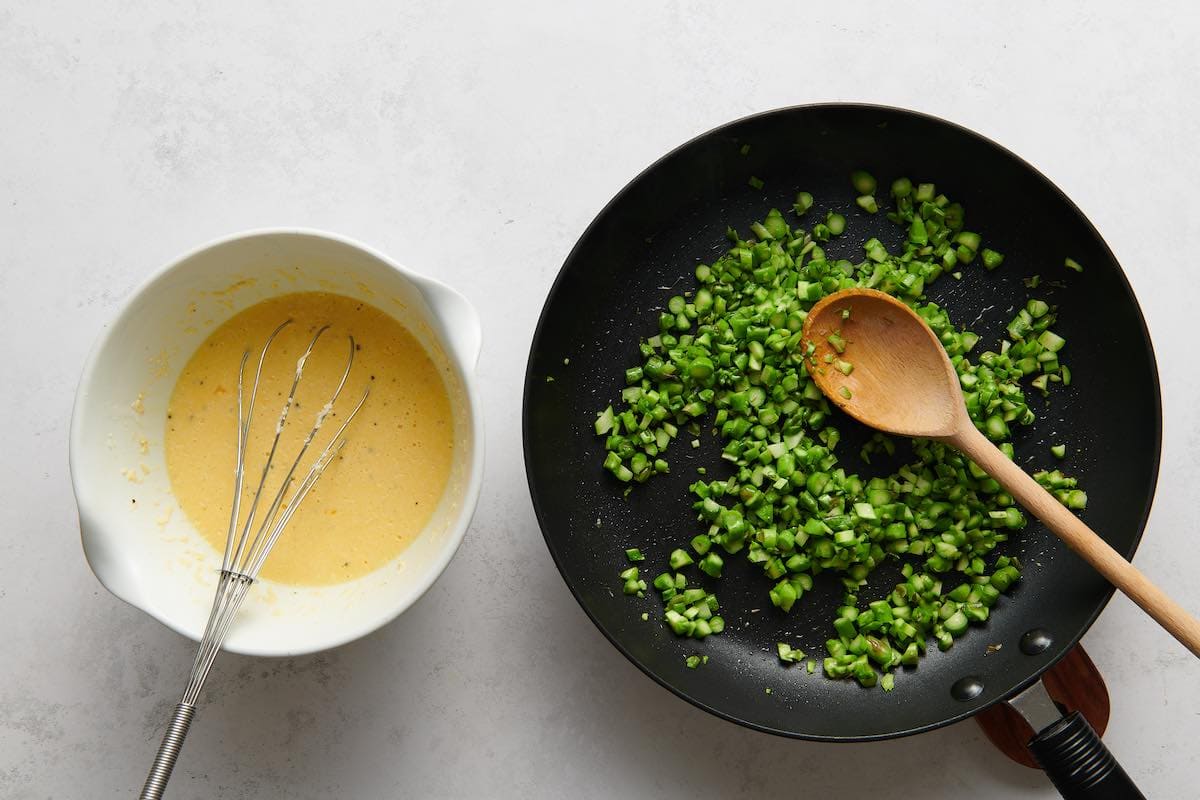 pan frying asparagus in a skillet.