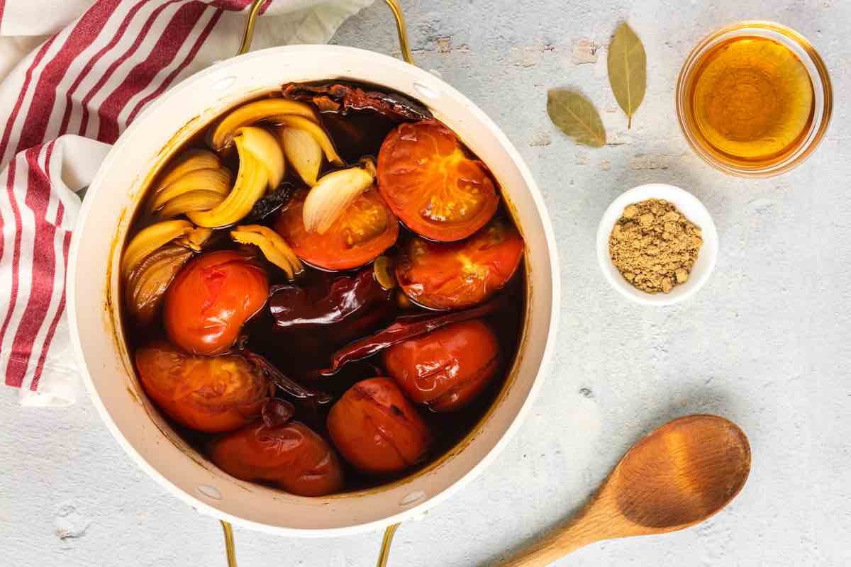 onions, broth, chilis, onions and seasonings in a bowl.