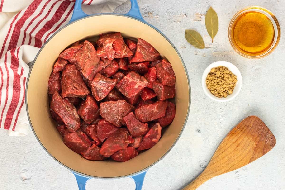 diced beef searing in a pot.