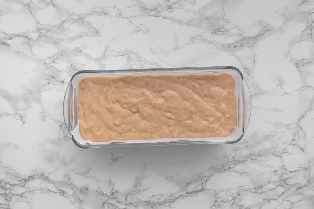 banana bread batter in a baking pan.