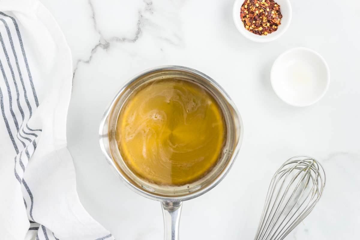 honey and vinegar in a pot.