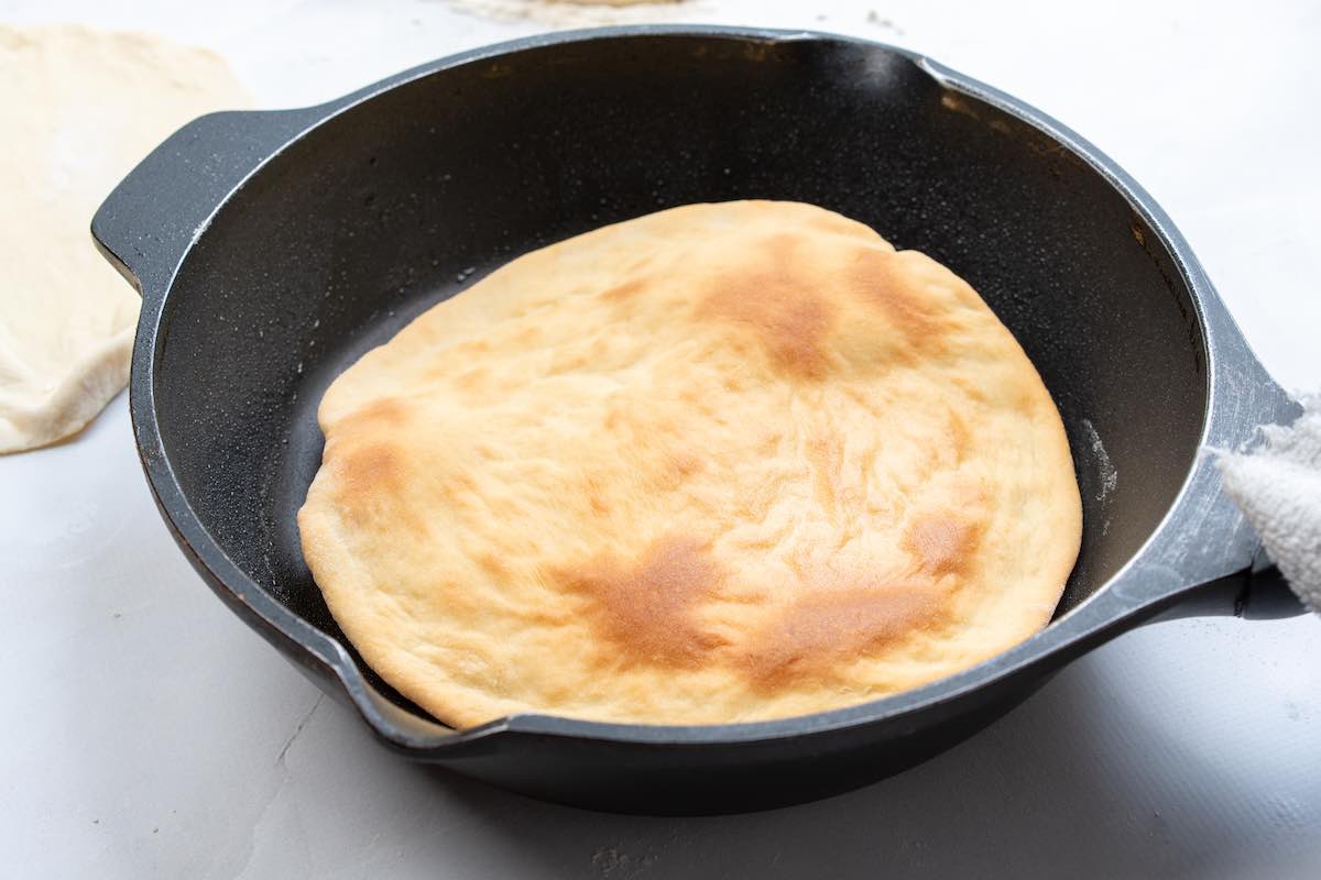 Lebanese bread cooked in a skillet.