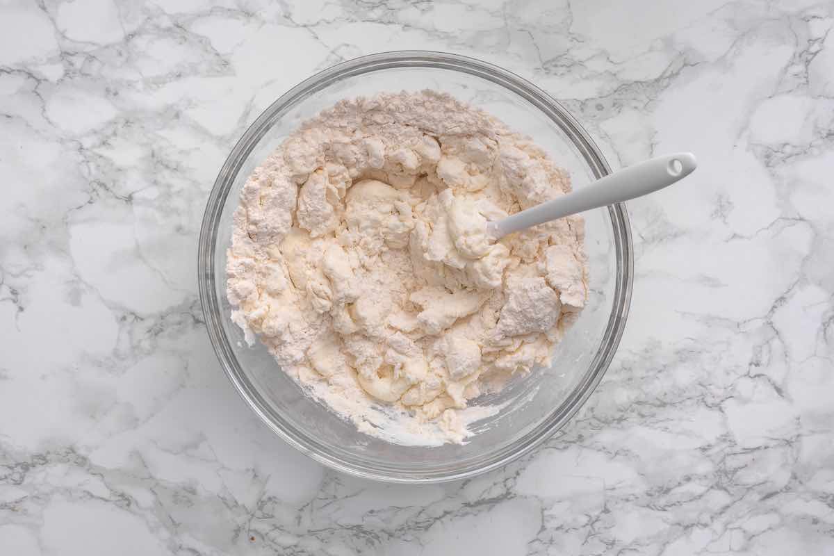 self rising flour and Greek yogurt in a bowl.