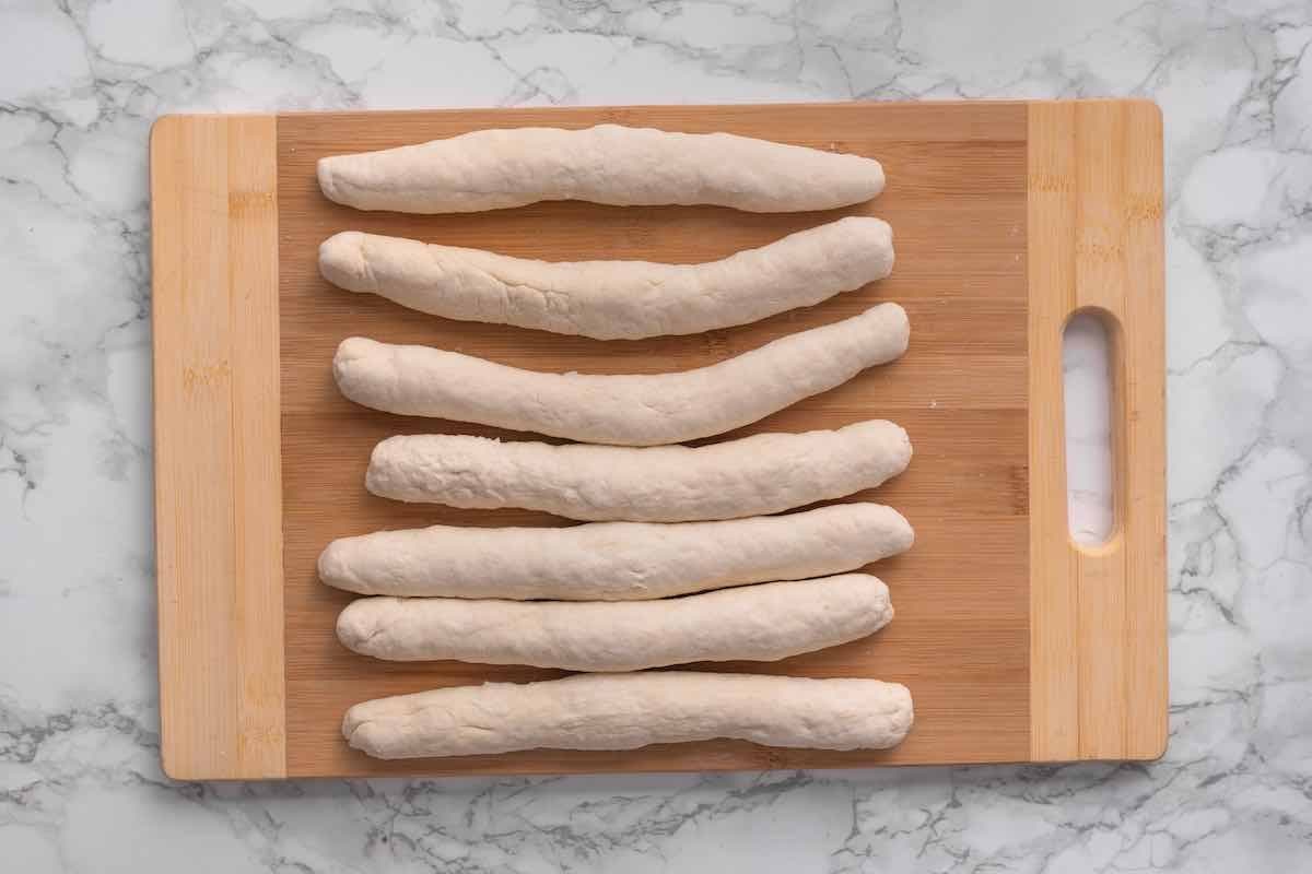 rolled out dough on a wooden board.