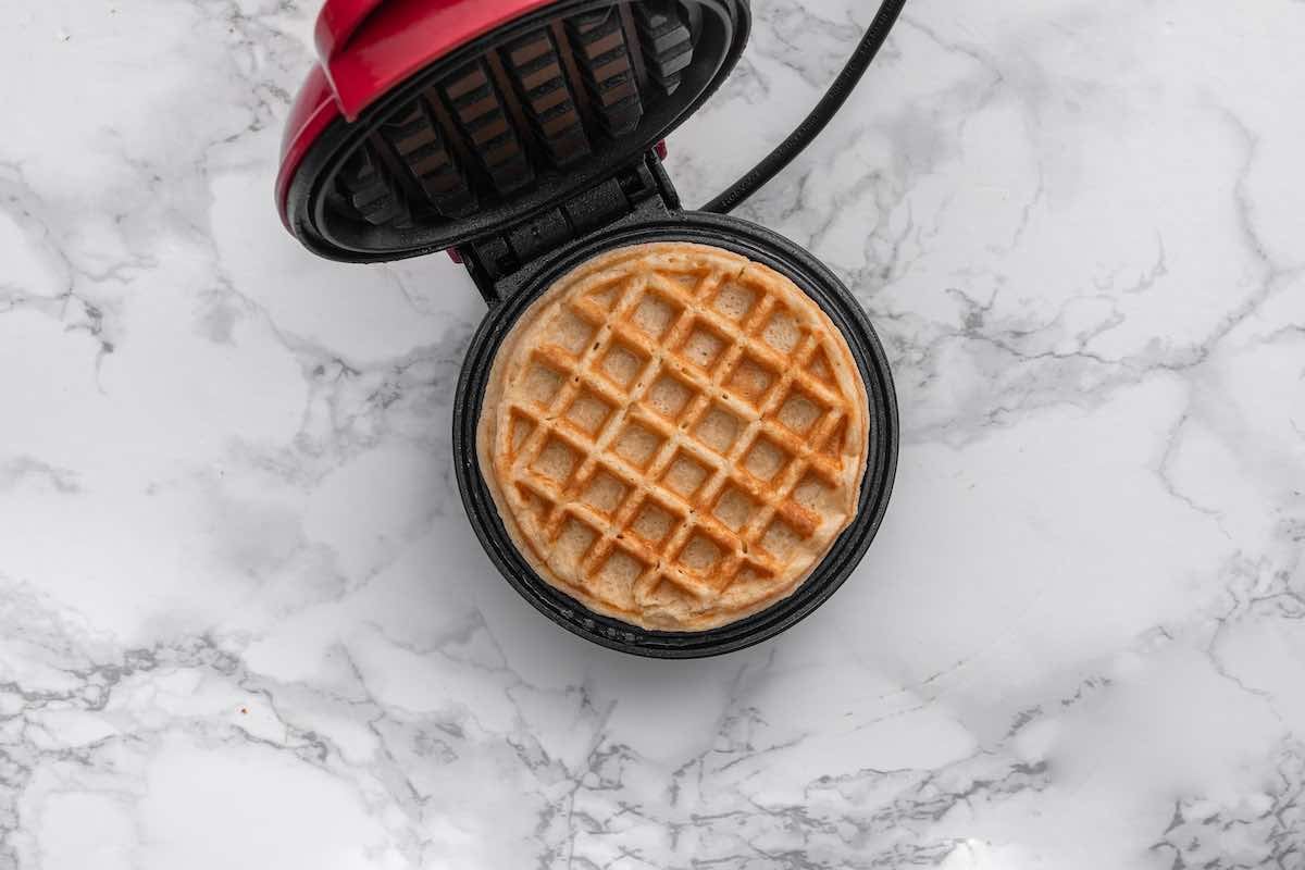 cooking waffles in the waffle iron.
