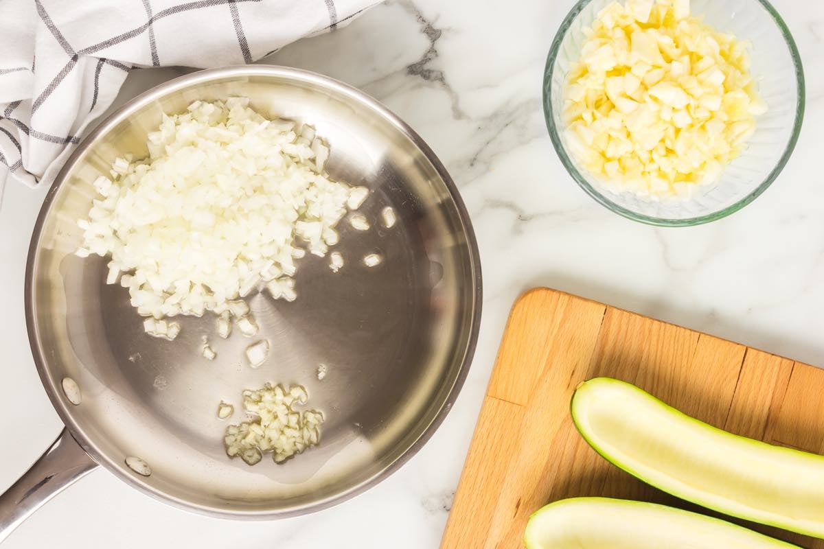 garlic and onion sauteing in a pan.