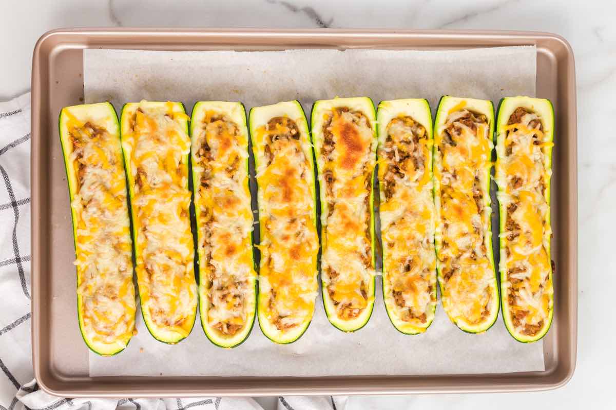 baked zucchini boats on a baking sheet.