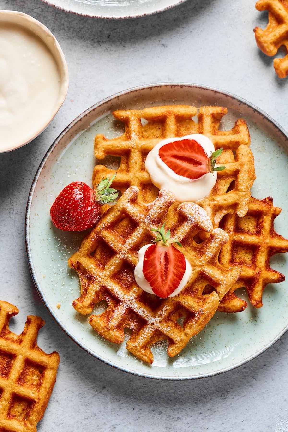 low carb waffles with fresh berries and whipped cream.