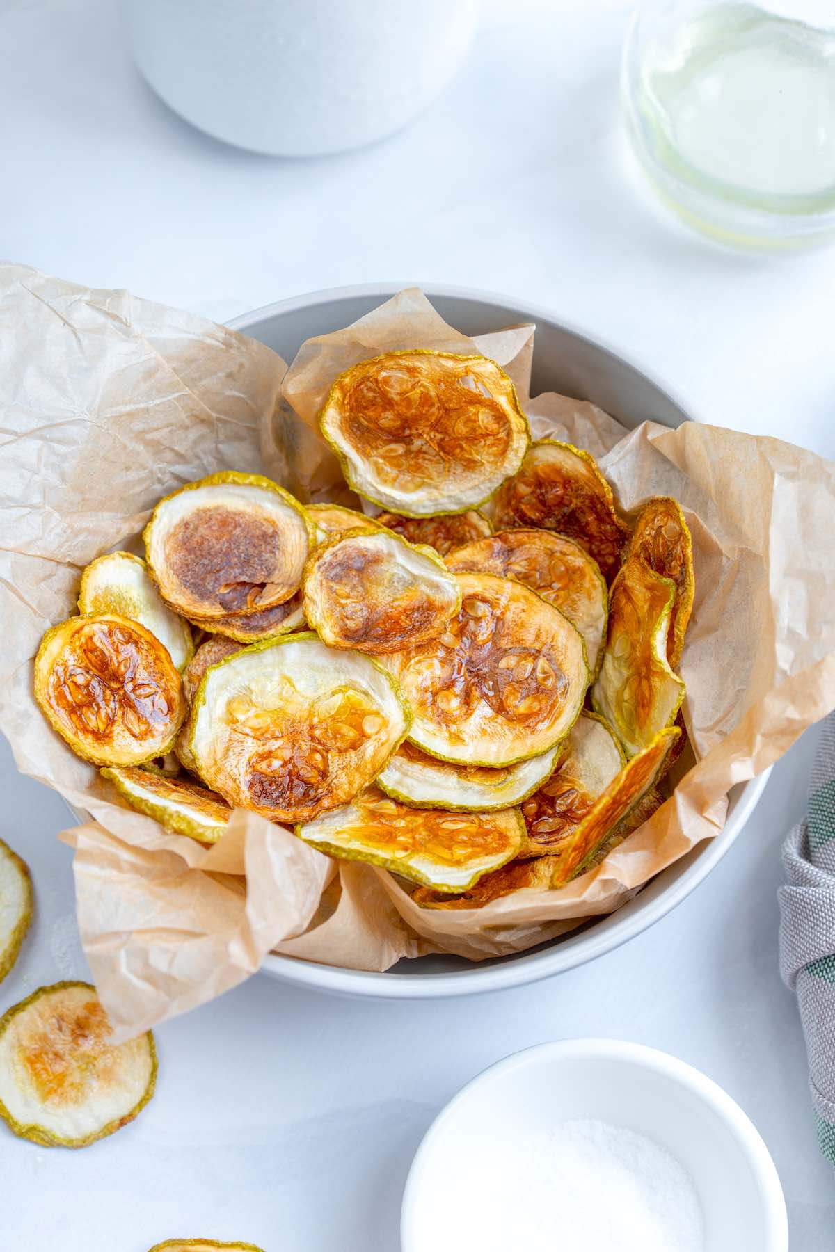 crispy baked zucchini chips in a bowl.