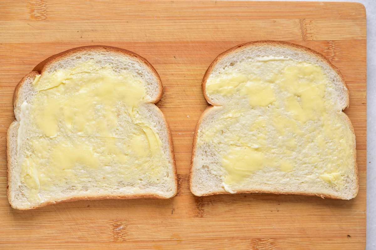 slices of bread with butter and mayonnaise.
