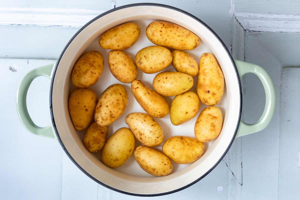 potatoes boiling in a deep pot.