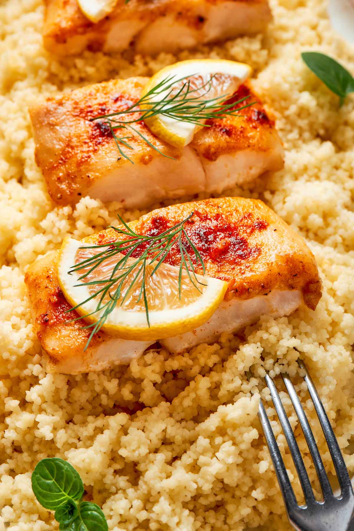 baked halibut over a bed of couscous.